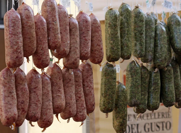Salami and cotechini hung in the butcher shop