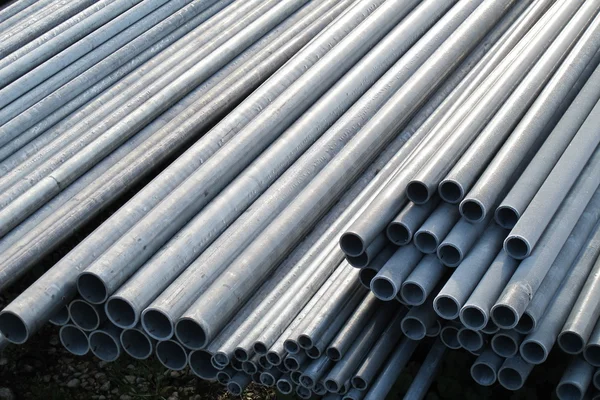 Pile of iron pipes for the transport of electrical cables and op