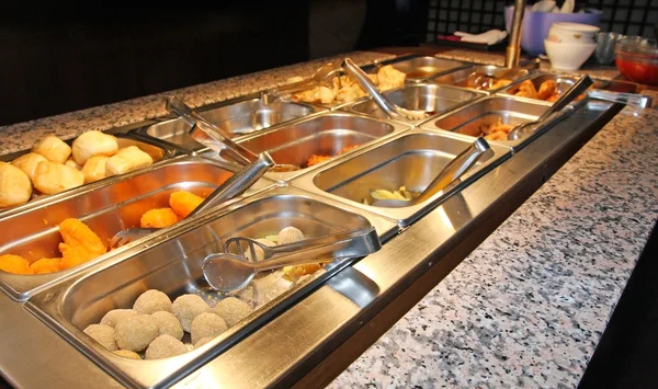 Tray filled with food inside the self service Chinese restaurant