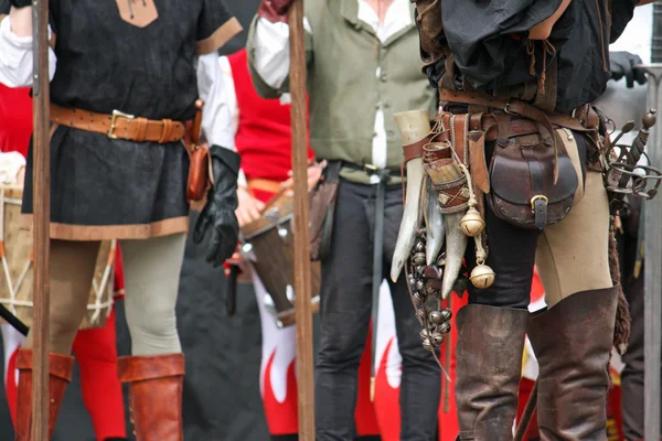 Leather pants with medieval accessories during the medieval spec