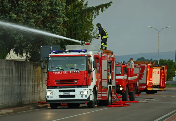 Firefighters with the fire truck when switching off a fire