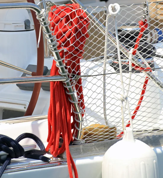 Red rope to moor a yacht in the harbor