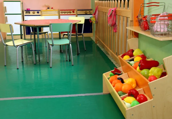 Nursery with stand and wooden kitchen toy
