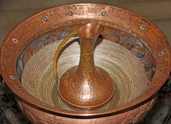 Jug with the font for baptism of Christians
