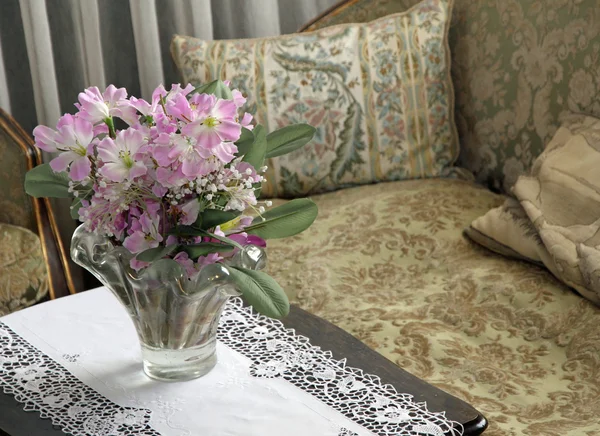 Lounge for nobles in a villa with a vase of fresh flowers