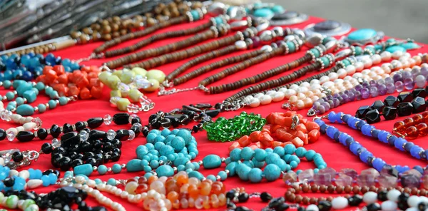 A lots of jewelry and gemstone necklaces for sale at a jewelry s