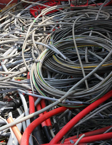 Cables and copper cables in a container for recycling of materia