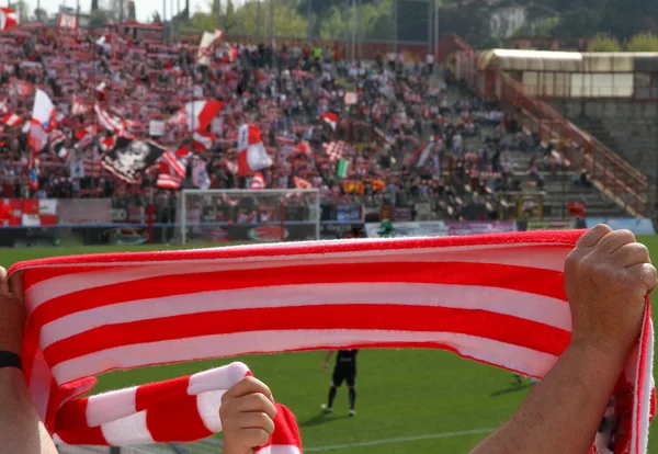 Red and white scarf of the fans in the Stadium 3