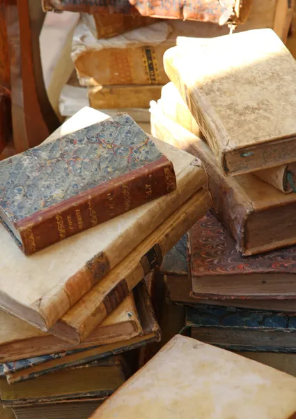 Piles of old books in a book shop in europe