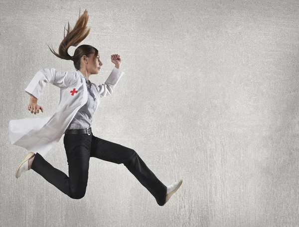 Doctor running over isolated background