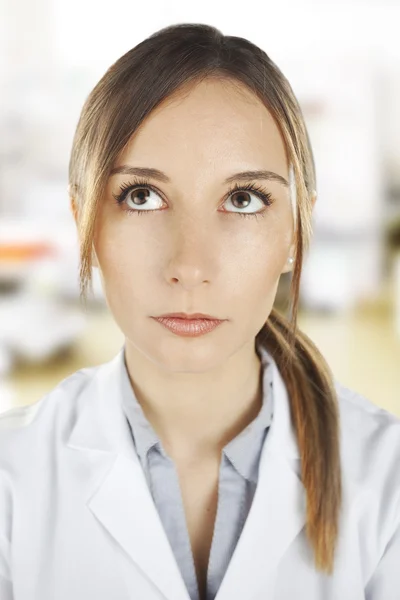 Portrait of medical woman thinking at hospital