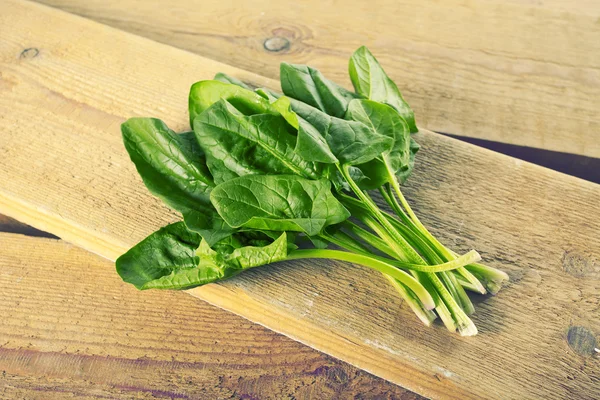 Chard leaves on a wooden table