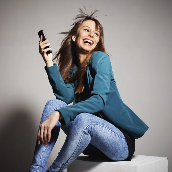 Young business woman smiling with smart phone