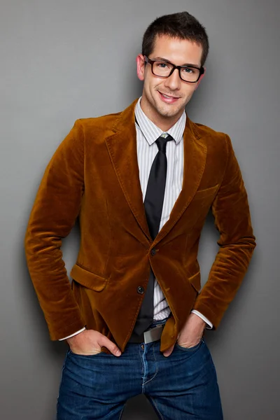 Young interesting businessman with rimmed glasses