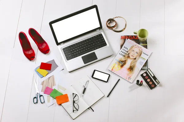 Overhead of a essentials objects in a fashion blogger