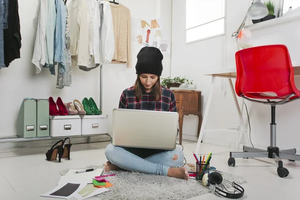 Casual blogger woman working in her fashion office.