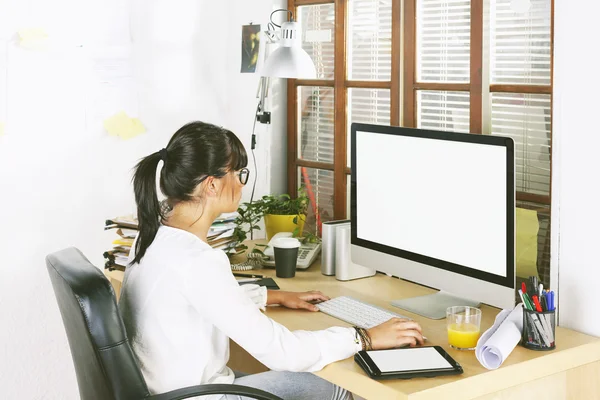 Young entrepreneur woman working on home office.