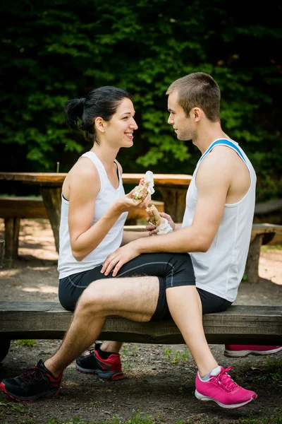 Eating together - couple after jogging