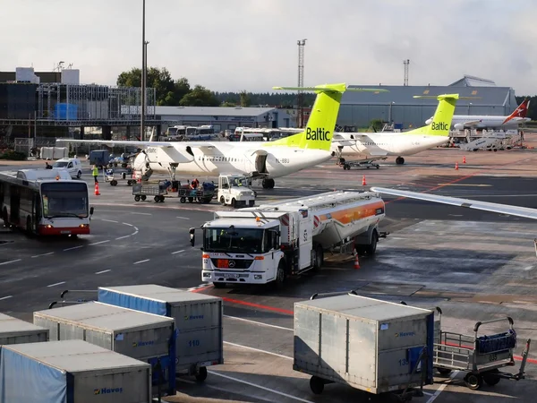 Air Baltic airplanes in Riga airport. Air Baltic is the Latvian flag carrier airline and a low-cost carrier
