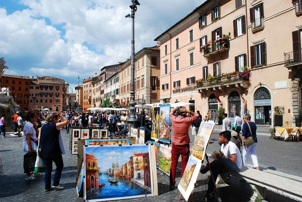 Tourists in Rome city Navona place on May 29, 2014