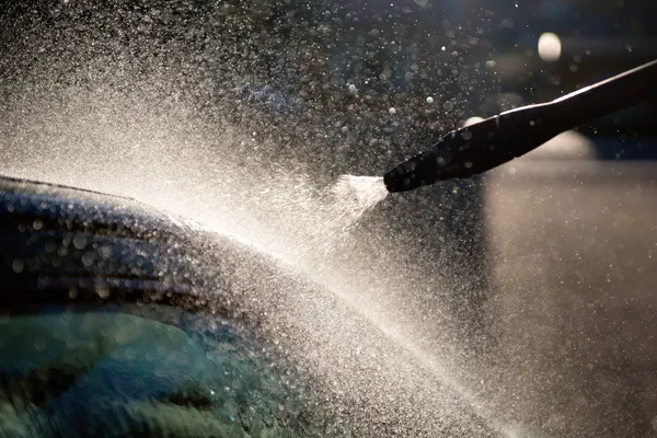 High pressure washer used on car