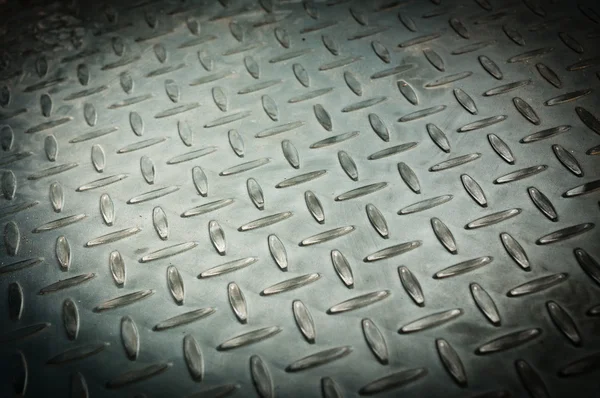 Closeup of metal diamond plate, texture background