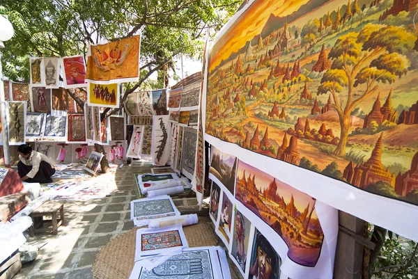 Sand paintings for sale outside a temple