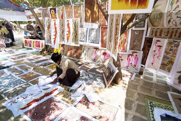Sand paintings for sale outside a temple