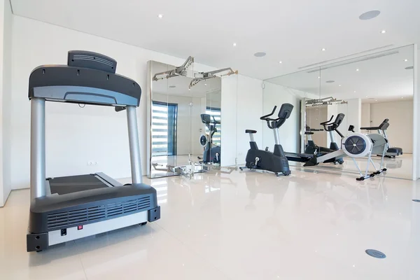 Fitness gym at home. With exercise equipment.