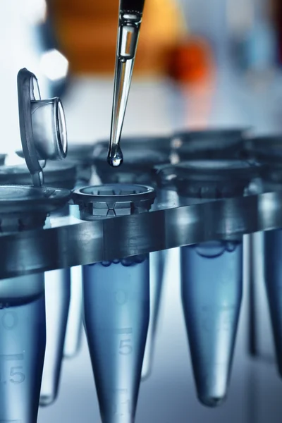 Detail of a Laboratory pipette with drop over tubes rack