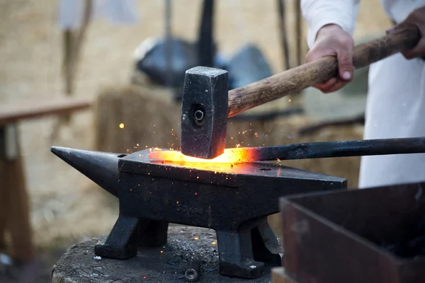 Blacksmith working hot iron