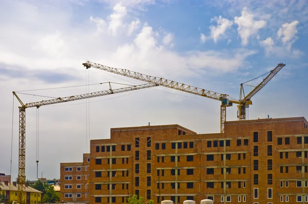 Three high heavy cranes on construction new big house