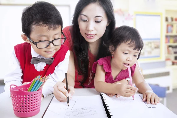 Mother teach children to write