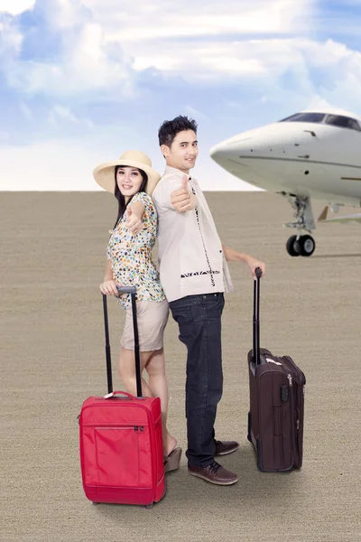 Asian couple travel by airplane