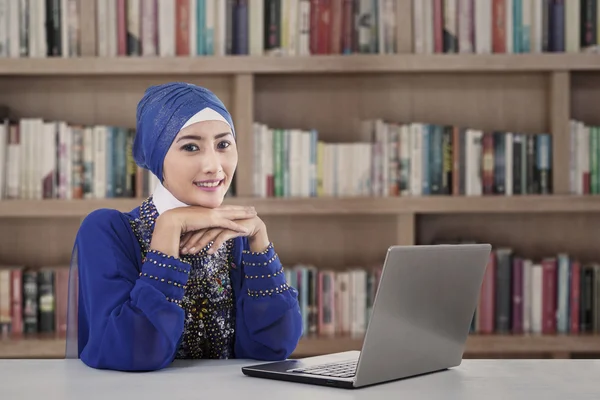 Beautiful muslim girl at library