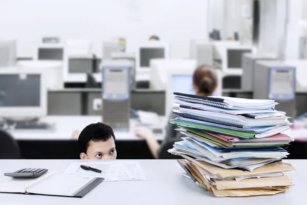 Businessman with lots of papers