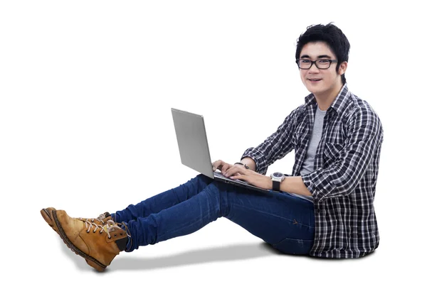 Asian man using laptop