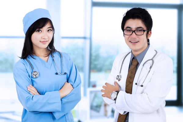 Doctor and a surgeon in pose