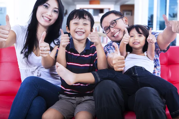 Happy family having fun on the couch