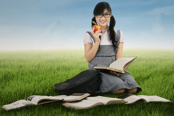 Female student studying outdoors