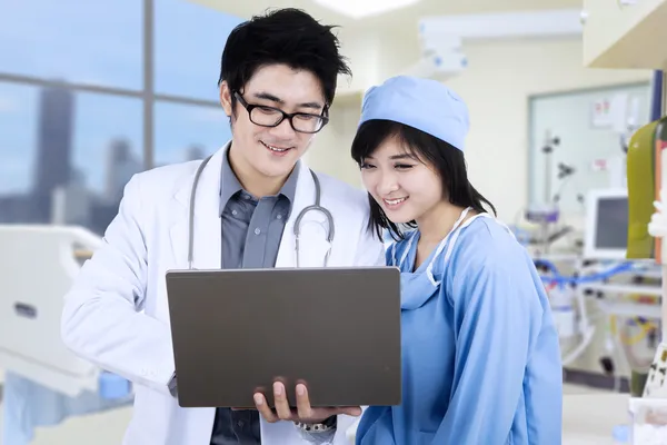 Medical team using laptop computer