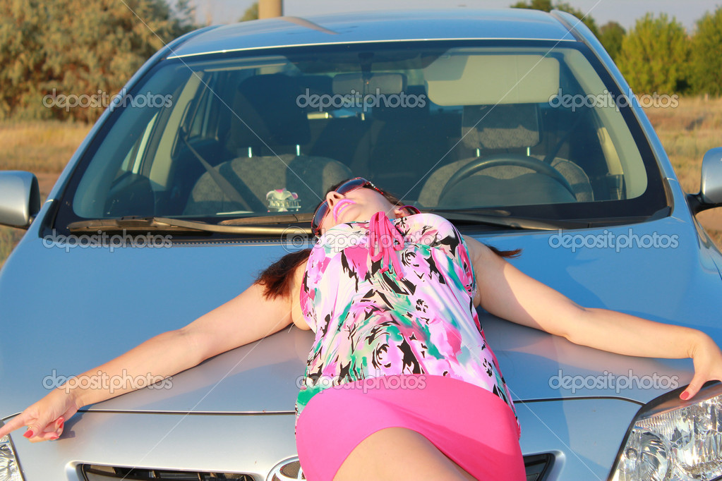 Girl lying on a car hood — Stock Photo © yli9445yli9445 12657232