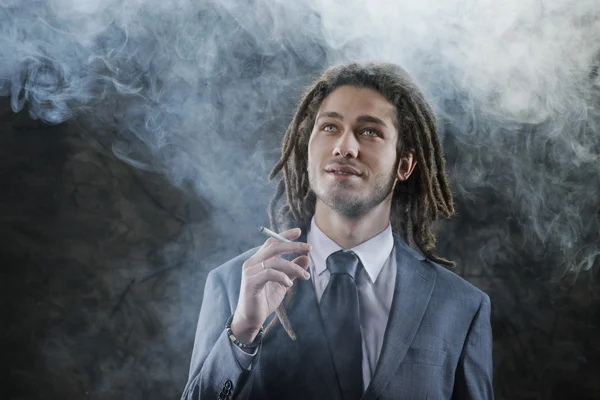Businessman smoking a joint