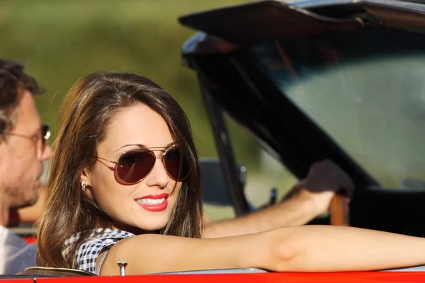 Portrait of a couple in a convertible car