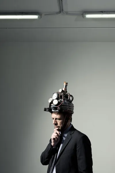 Creative businessman with steampunk helmet