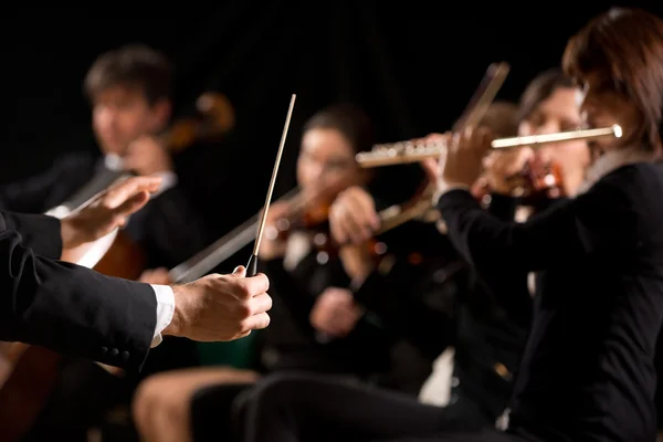 Conductor directing symphony orchestra