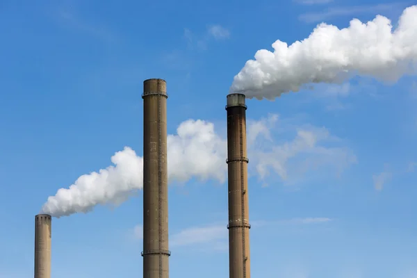 Industrial smoke stacks of a power plant.