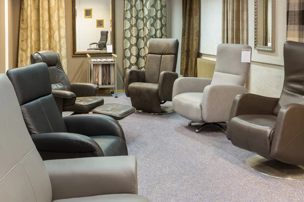 Showroom of modern furniture store with luxury armchairs