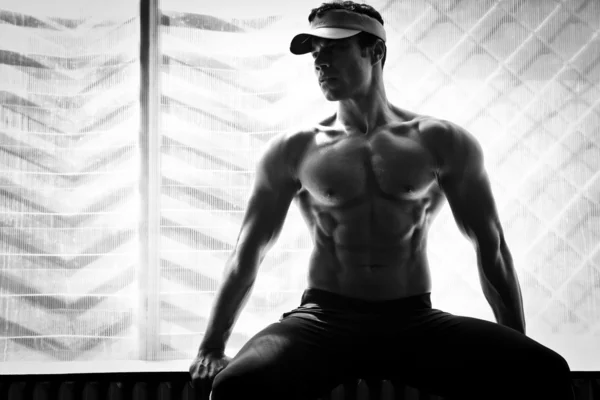 Bodybuilder posing gym
