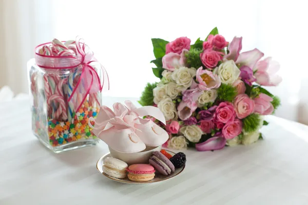 Macaroons, flowers and candy